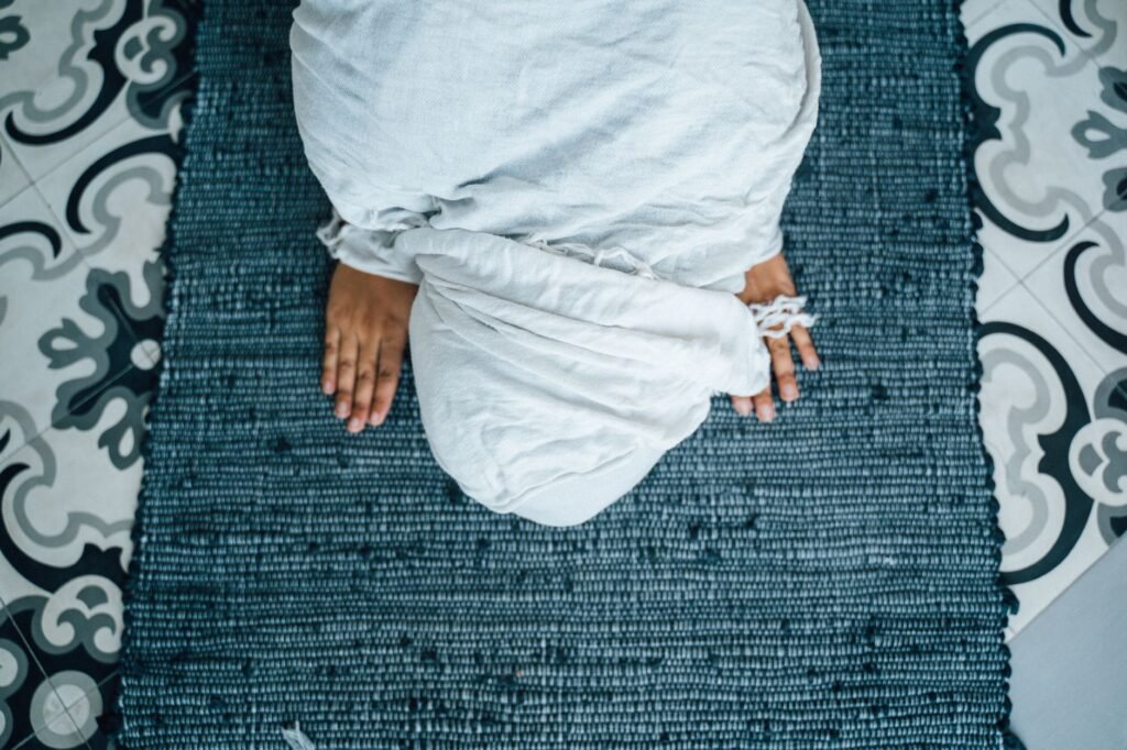 Grieving person praying Turning Prayer into Practice