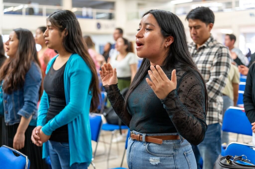Students praying together A Call to Action