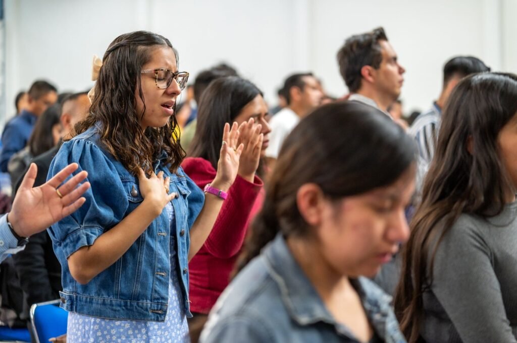 Students praying together The Role of Prayer in Transformation