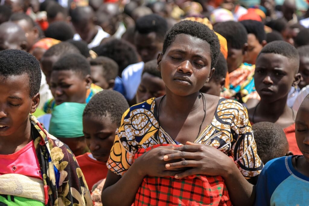 A community gathered in prayer represents the strength found in shared hope and faith
