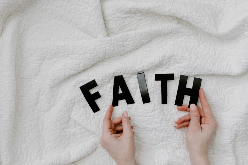 A person in prayer during a difficult time, illustrating faith amidst challenges