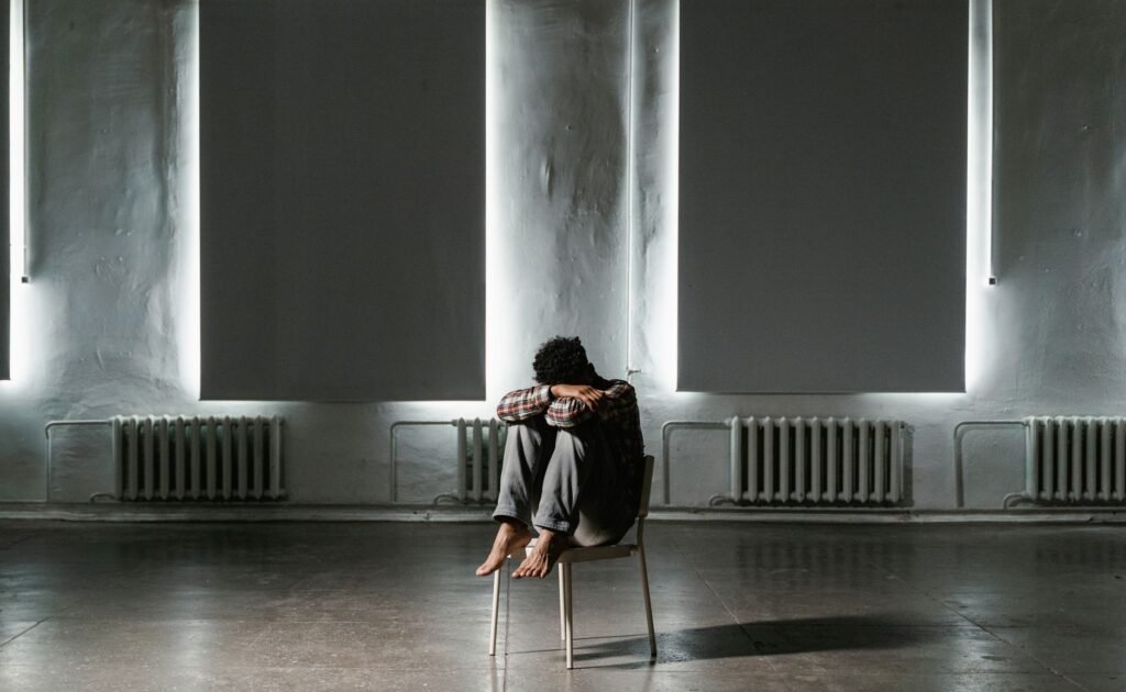 A person praying, finding comfort in their faith during difficult times