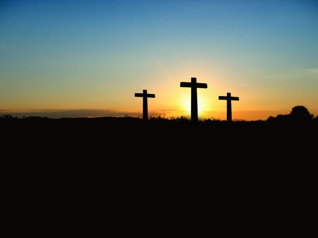The cross against a sunrise symbolizes hope and the new life found in Christ