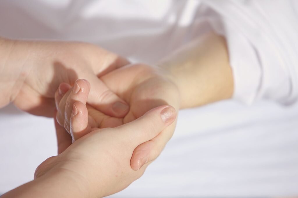 A comforting image of hands reaching out in prayer