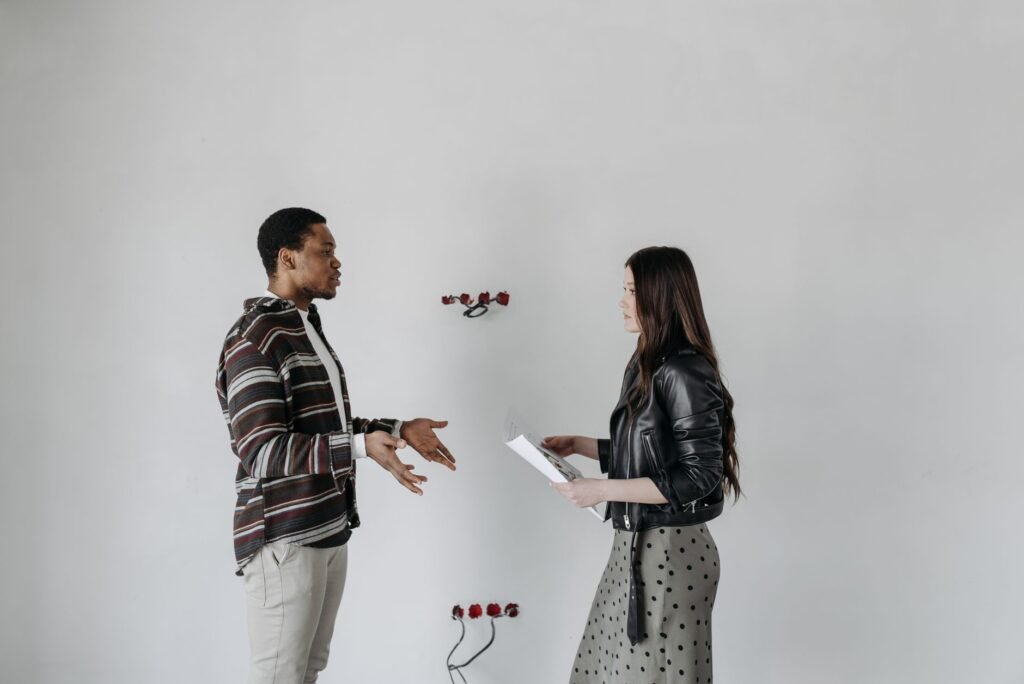 A couple engaged in a heartfelt discussion, working through challenges together