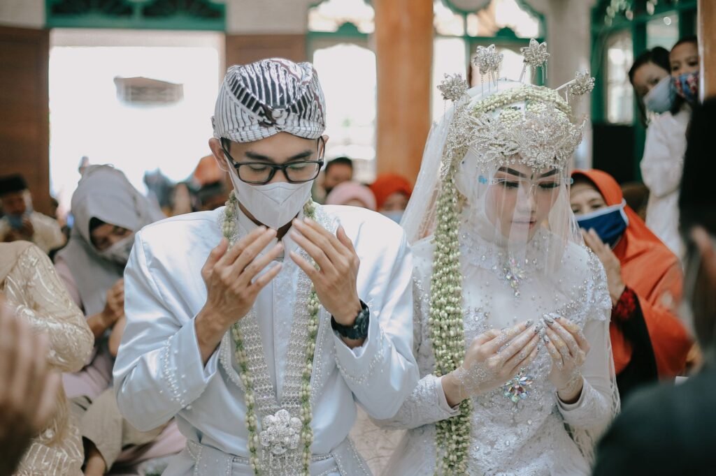 A couple kneeling in prayer, seeking God's guidance for their marriage