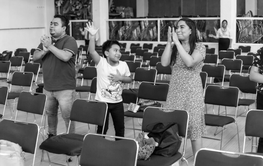 A family gathered in prayer, showcasing unity and love