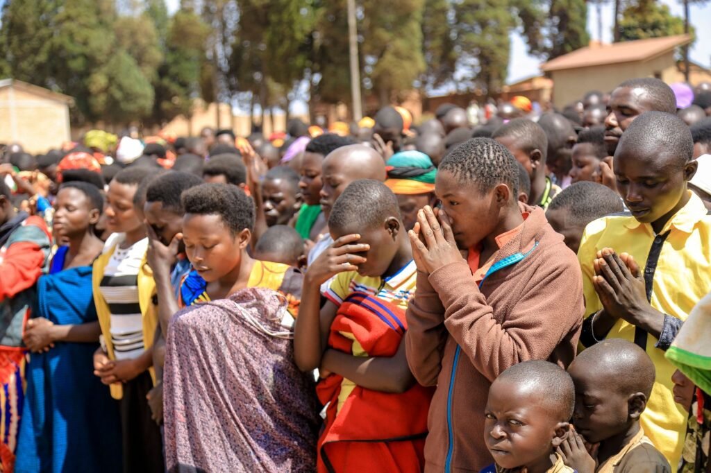 A family praying together in a circle, creating a supportive environment for prayer