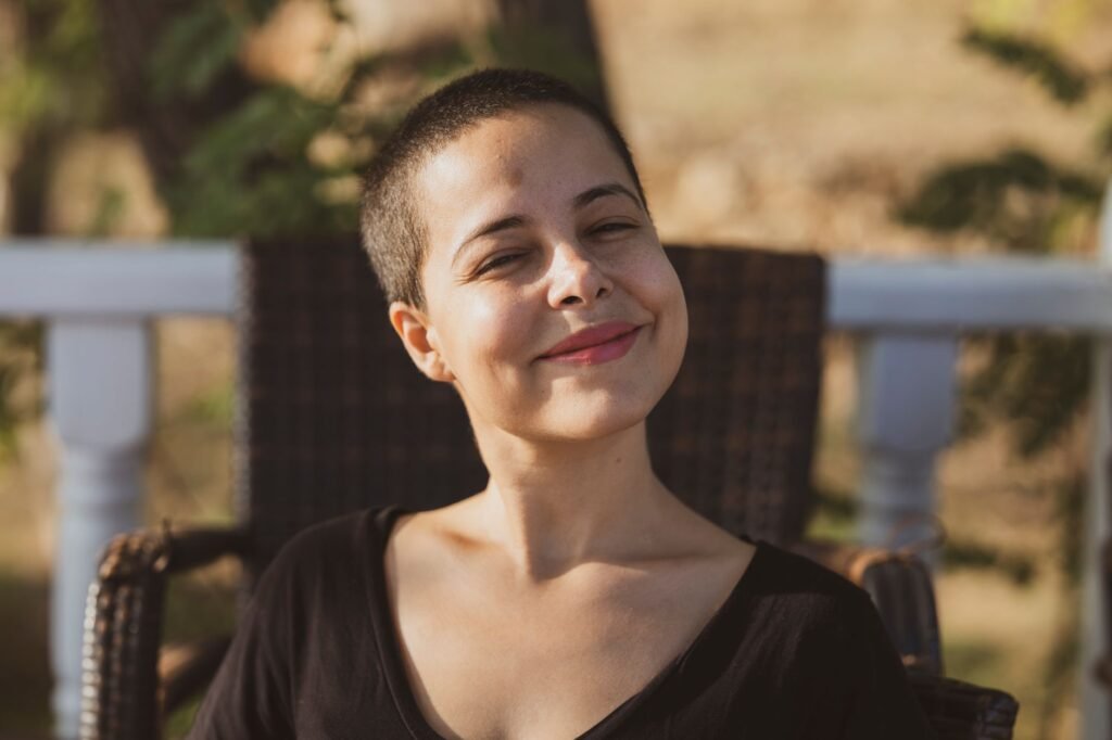 A joyful person outdoors, representing the joy found in faith during trials