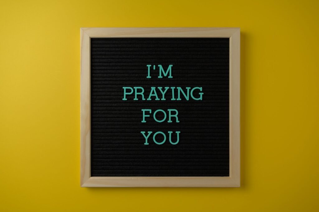 A pair of hands clasped in prayer, symbolizing seeking comfort