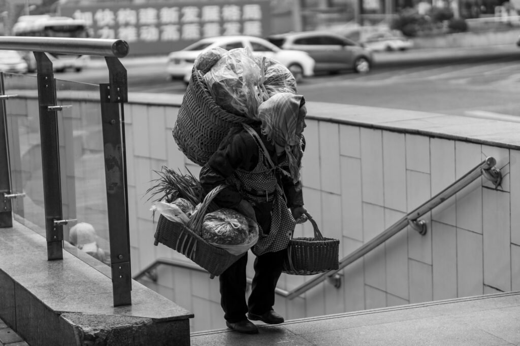 A person carrying a heavy load, symbolizing the weight of guilt