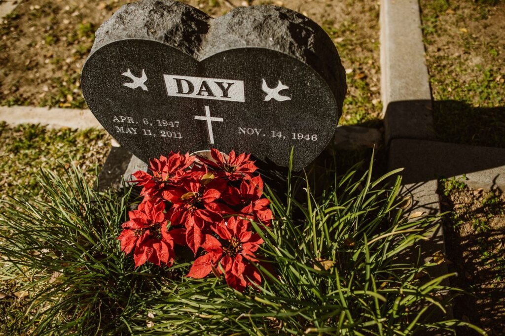 A person holding a heart-shaped stone in remembrance