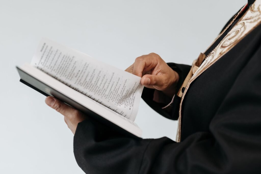 A person reading the Bible, reflecting on the teachings of kindness