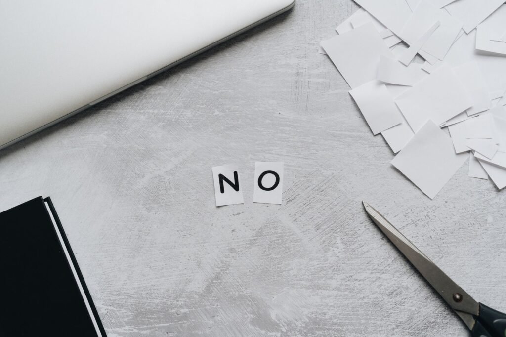 A person reflecting in prayer after experiencing rejection