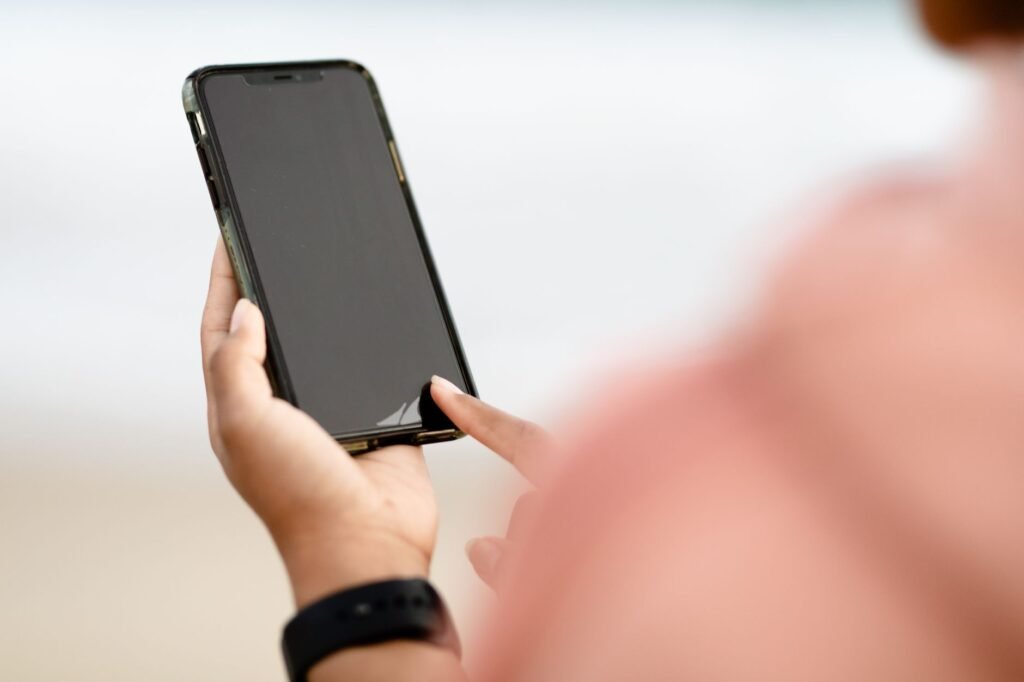 A person using a smartphone to engage with scripture