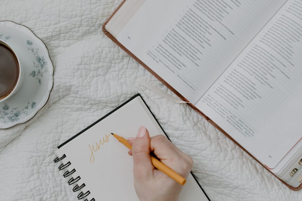 A prayer journal open to a page filled with handwritten prayers and reflections