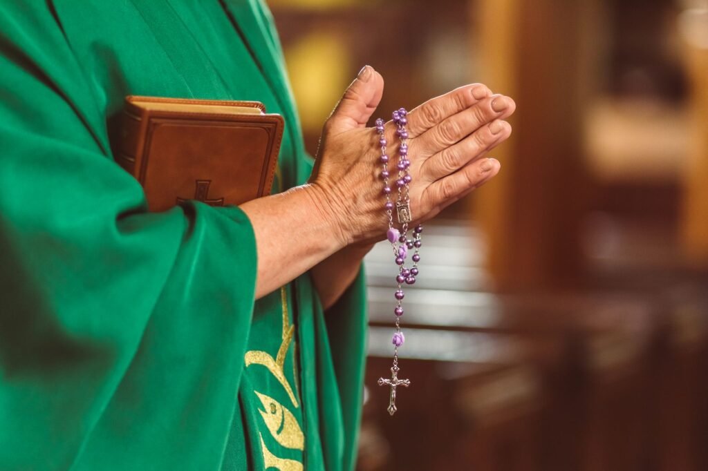 A serene image of hands in prayer, representing connection with God during times of change