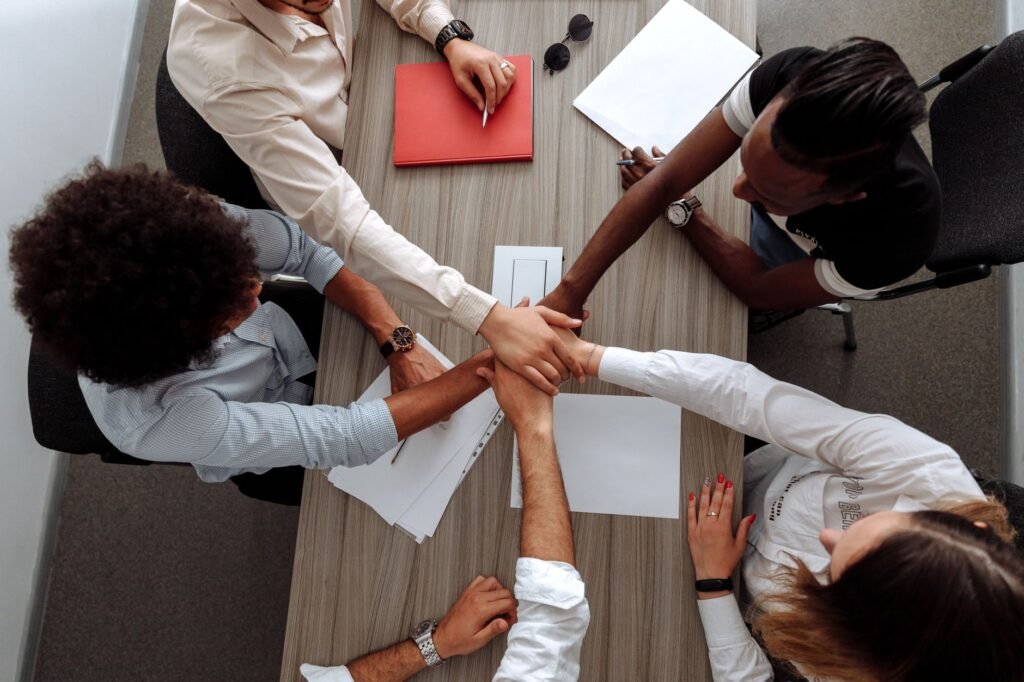 A team collaborating in an office, reflecting a spirit of service and teamwork