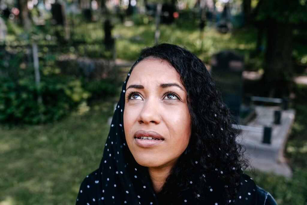 A woman in prayer, seeking strength from God in nature
