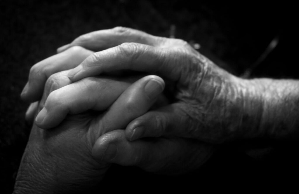 Hands reaching out to help others in need