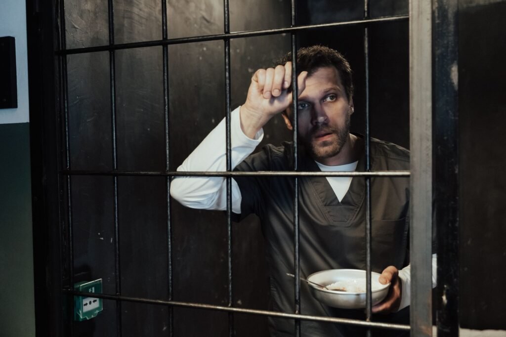 Joseph interpreting dreams while in prison, showcasing his faithfulness